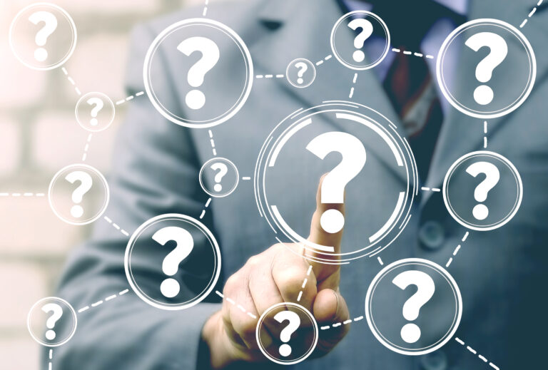 Businessman touching a network of connected question mark icons