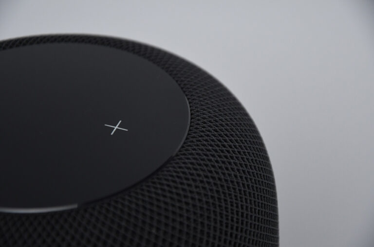 Close-up of the top of a black smart speaker