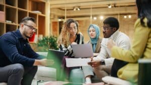 Enthusiastic Young Adults Analyzing New Data To Improve Startup Performance
