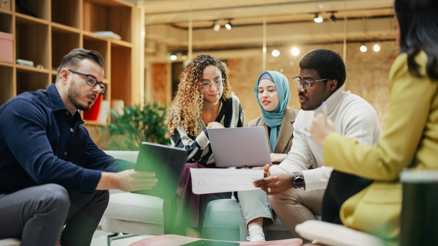 Enthusiastic Young Adults Analyzing New Data To Improve Startup Performance