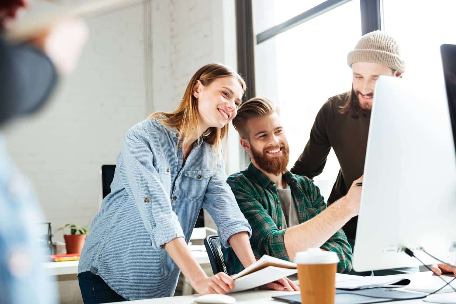 Concentrated colleagues in office using computer