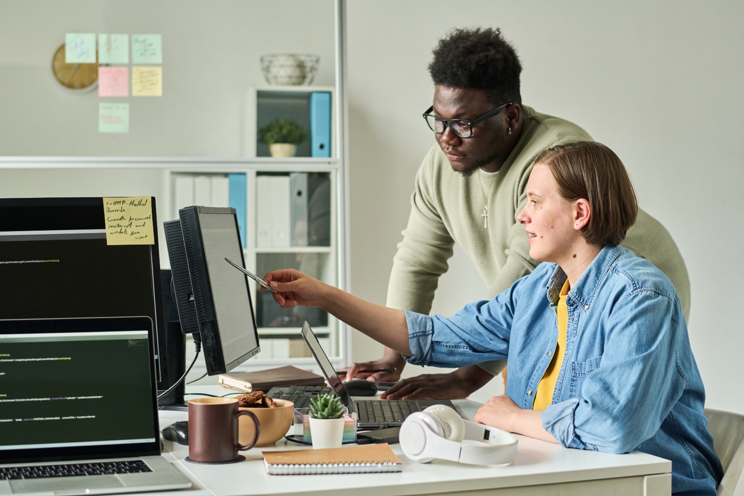 Colleagues discussing new presentation on computer
