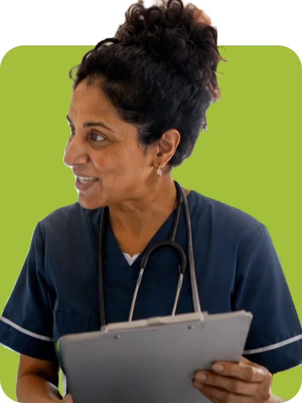 Nurse in scrubs holding a clipboard