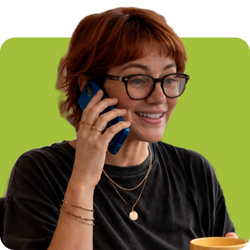 Recruiter in glasses smiling on a phone call